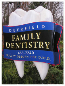 dental clinic hanging outside sign
