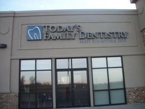 dental clinic tooth logo building attached sign
